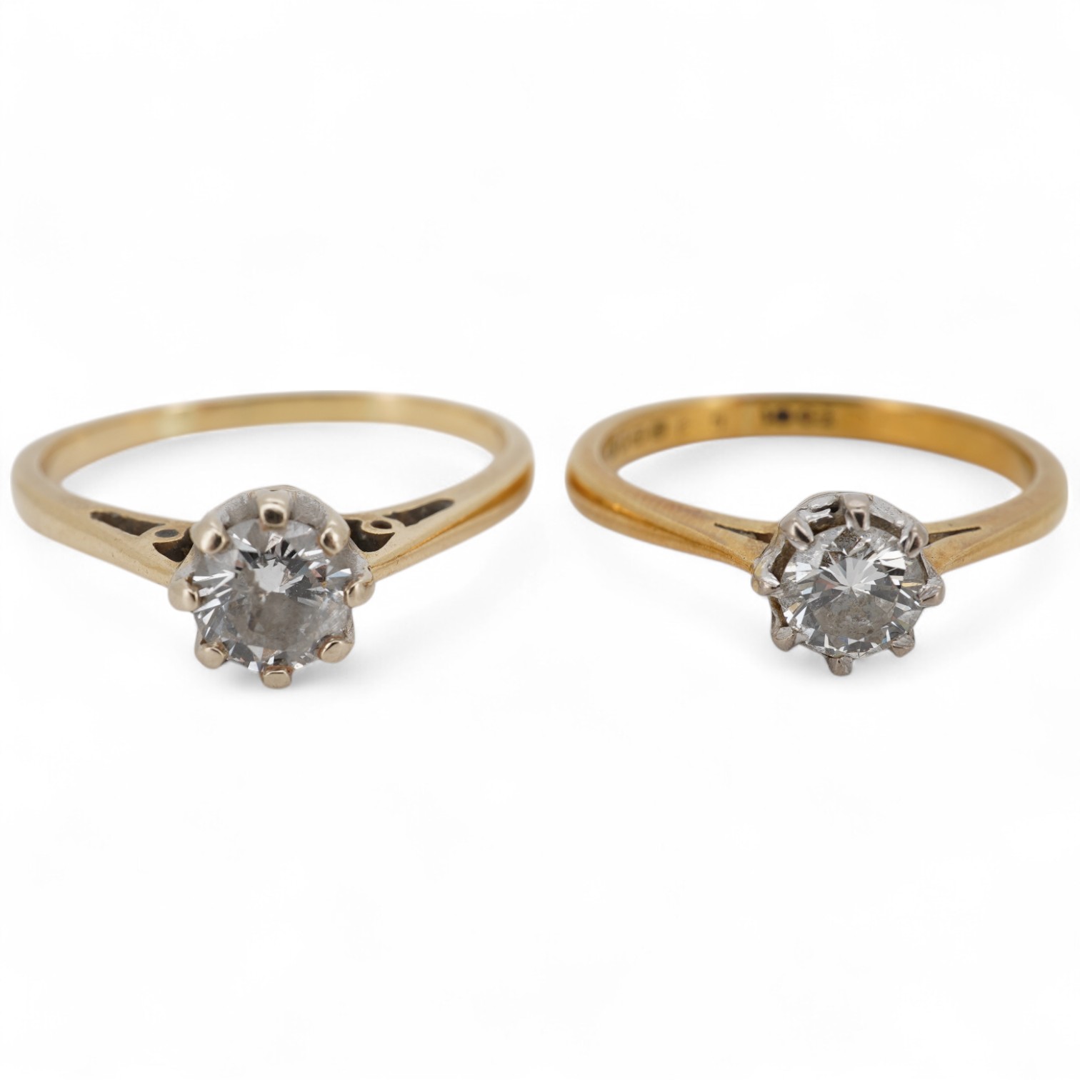 An early 1970's 18ct gold and claw set solitaire diamond ring, size K/L, the stone weighing approx. 0.33ct, together with a yellow metal and solitaire diamond ring, the stone weighing approx. 0.50ct, size P/Q, gross weig